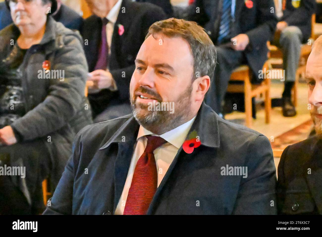 Beaminster, Dorset, UK. 12th November 2023.  Chris Loder MP for West Dorset, attends the Remembrance Sunday service and wreath laying at St Mary’s Church at Beaminster in Dorset. Picture Credit: Graham Hunt/Alamy Live News Stock Photo