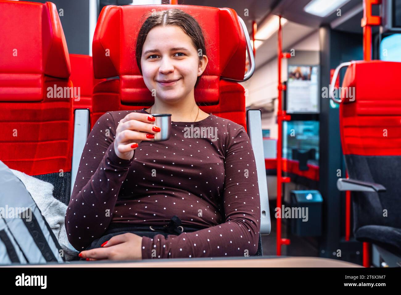 Woman sitting in train carriage hi-res stock photography and images - Alamy