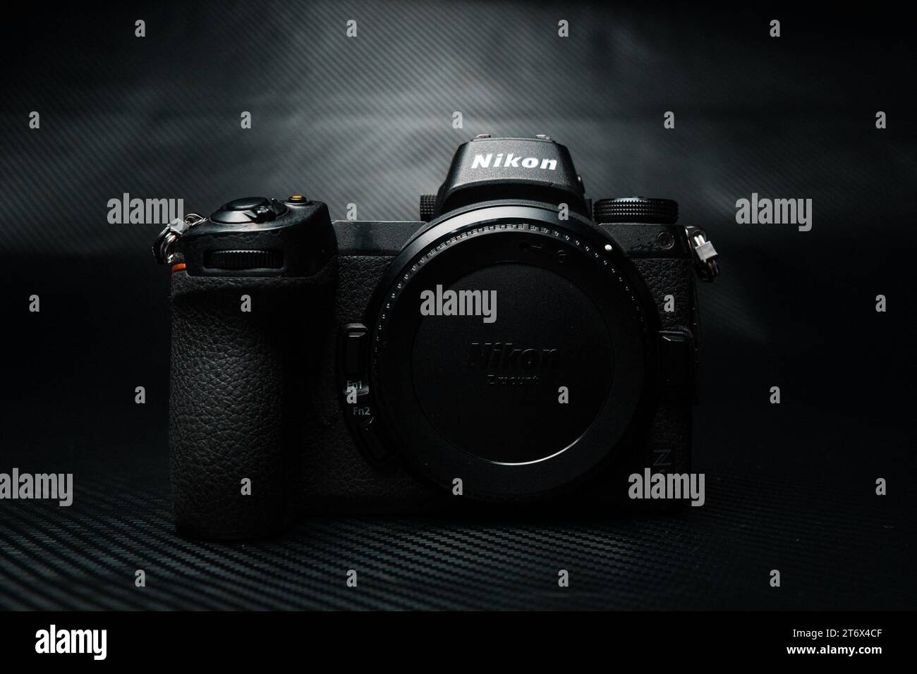 The Nikon Z6 digital SLR camera is illuminated by a bright flash in a