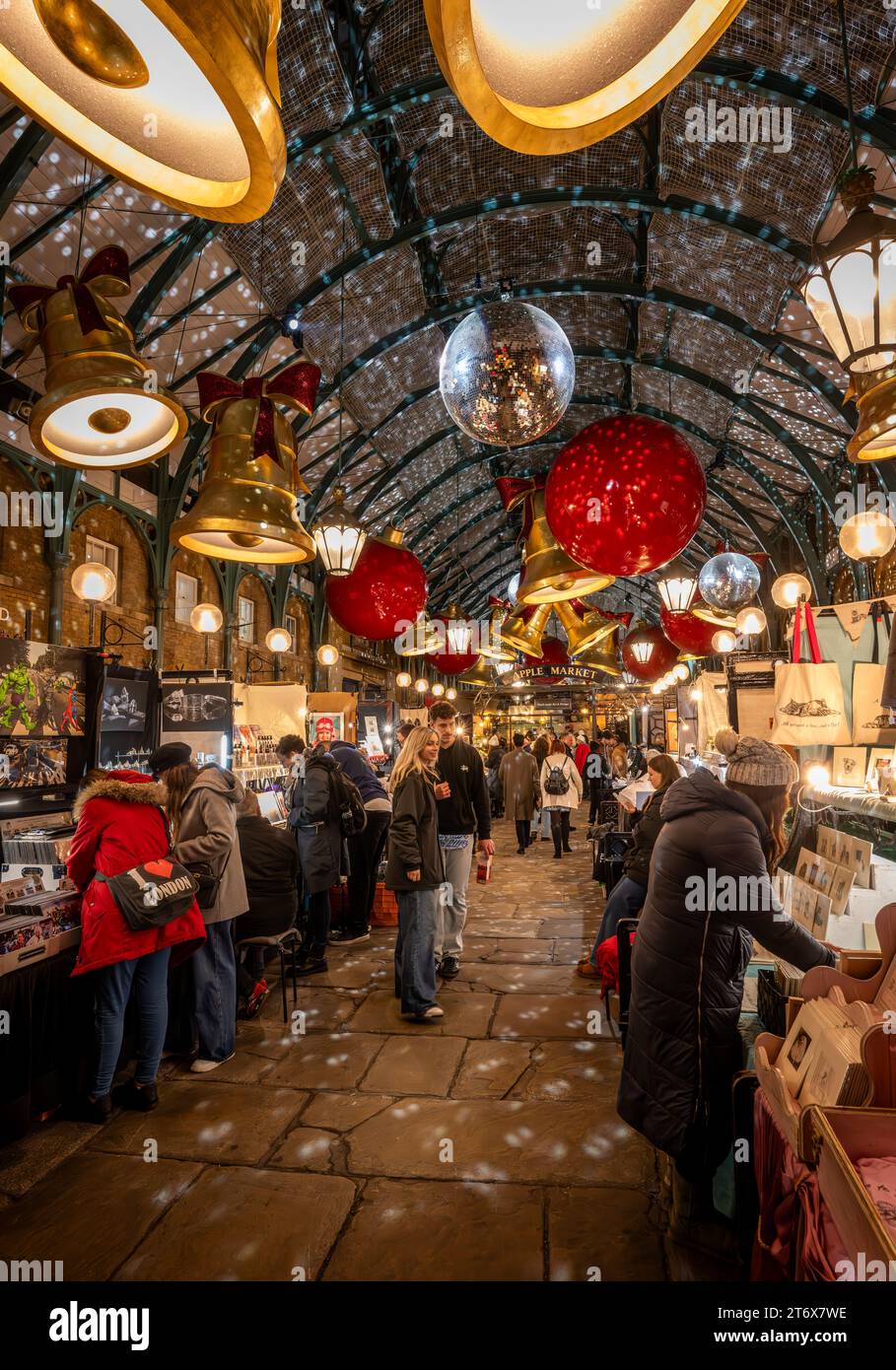 London, UK - Nov 8 2023: Covent Garden Market with Christmas decorations. People are Christmas shopping at the Apple Market. Stock Photo