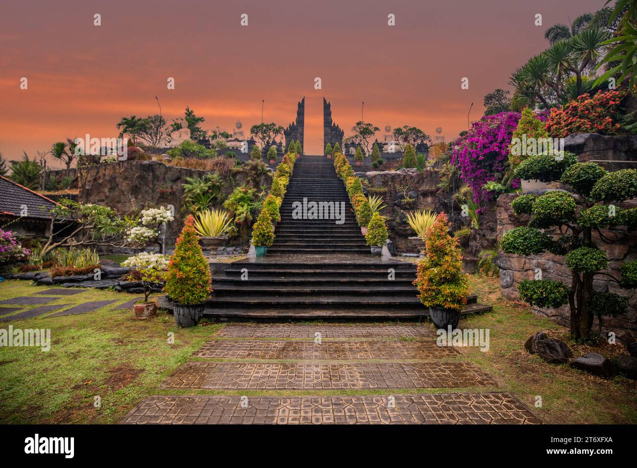 A Buddhist temple in the evening in the rain. The Brahmavihara-Arama temple has beautiful gardens and also houses a monastery. Stock Photo