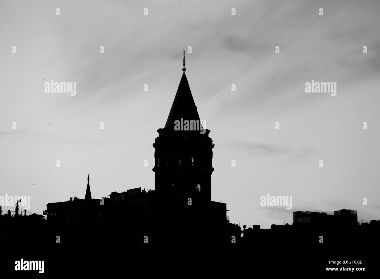 The Silhouettes of Historic Buildings by the Sea in Istanbul's Galata District Stock Photo