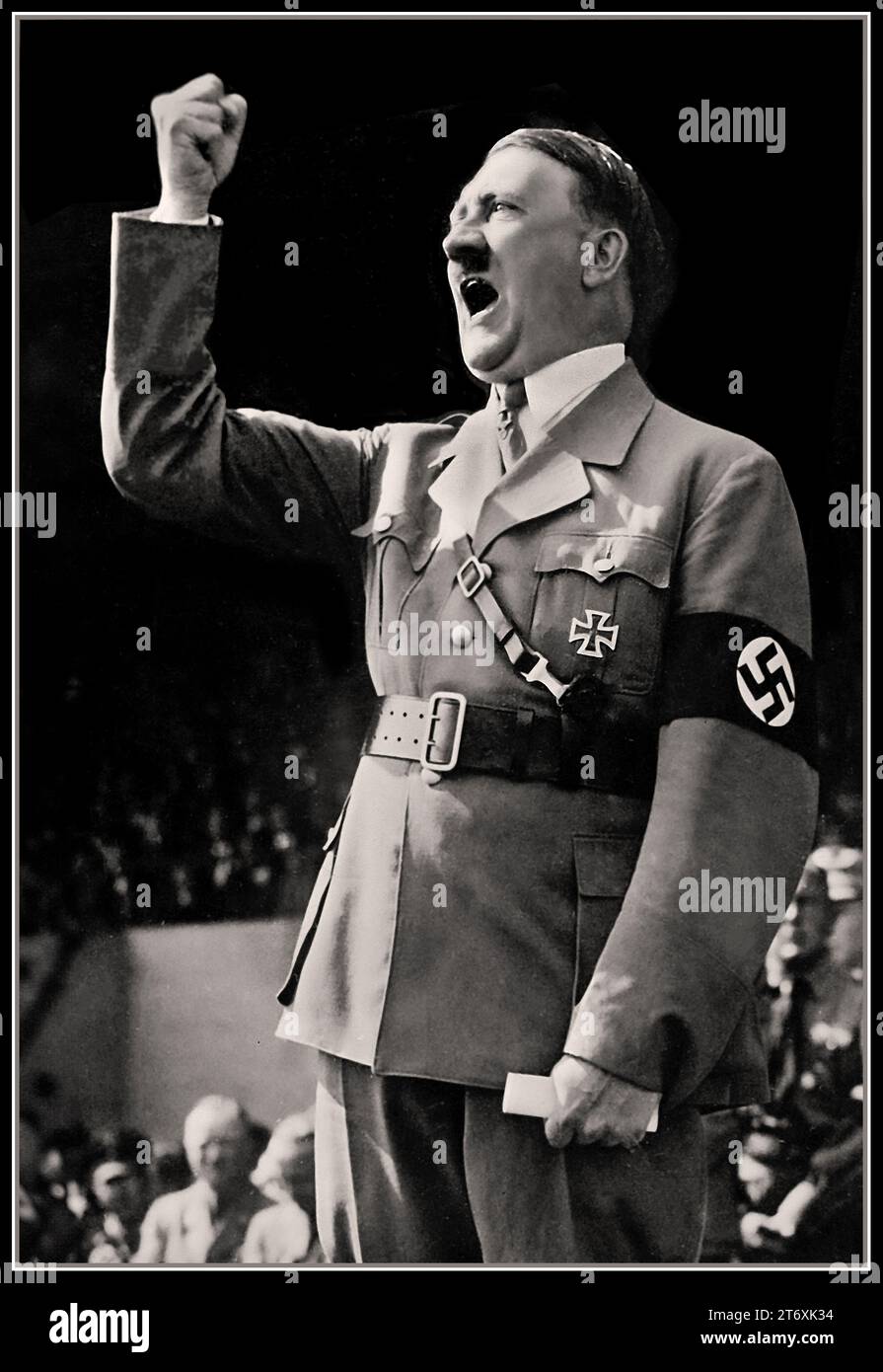 Adolf Hitler speech, leader of the Nazi Party and Fuhrer of Germany making an impassioned speech with his fist clenched, wearing military uniform with Iron Cross and Swastika armband. The day on which he became commander in chief of Nazi Germanys armed forces.  Nazi Germany 1934 Stock Photo