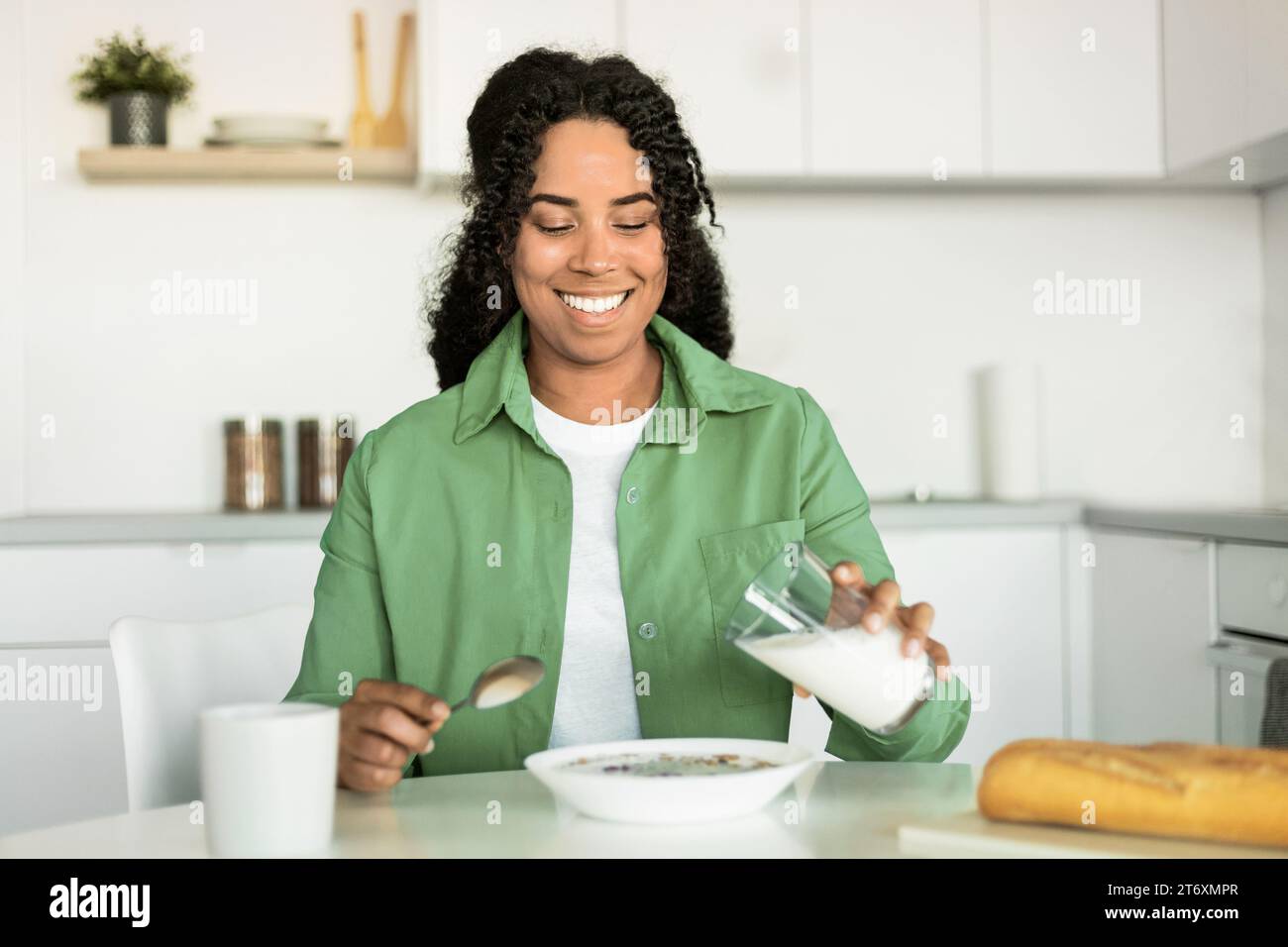 Cheerful black lady adding hi-res stock photography and images - Alamy