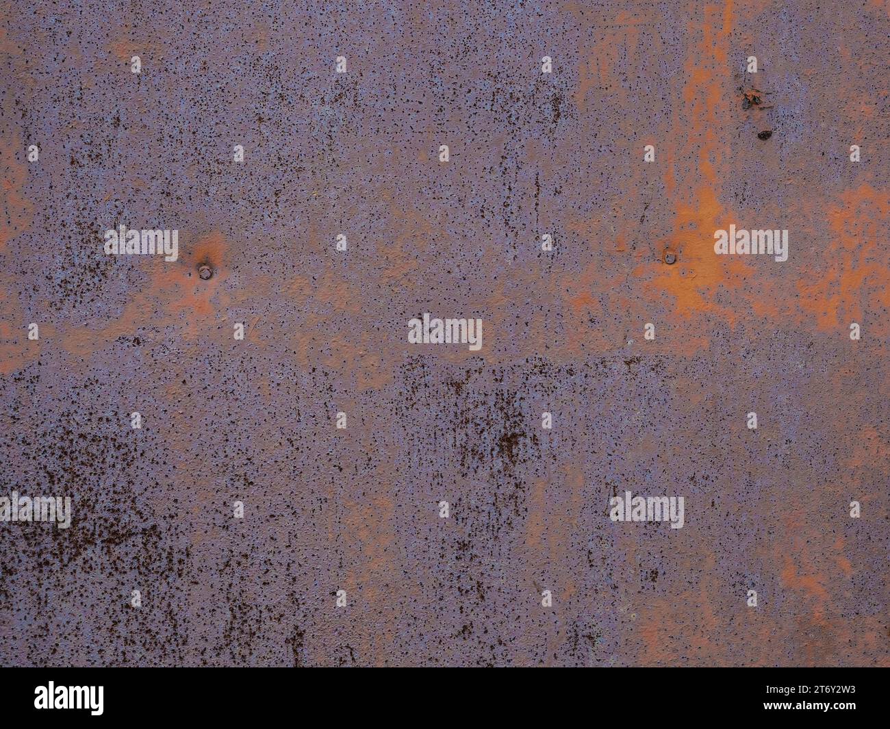 Grunge, rusty surface of metal sheet. Brown and metallic blue colors. Stock Photo