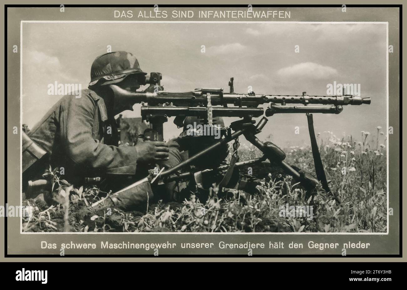 WW2 Propaganda Nazi MG-42 Machine Gun World War II Image of Wehrmacht Army Nazi soldier in battlefield  with MG-42 Machine Gun with optical sight, caption reads  'These are all infantry weapons' ''The heavy machine gun of our Grenadiers keeps the enemy down'' Stock Photo