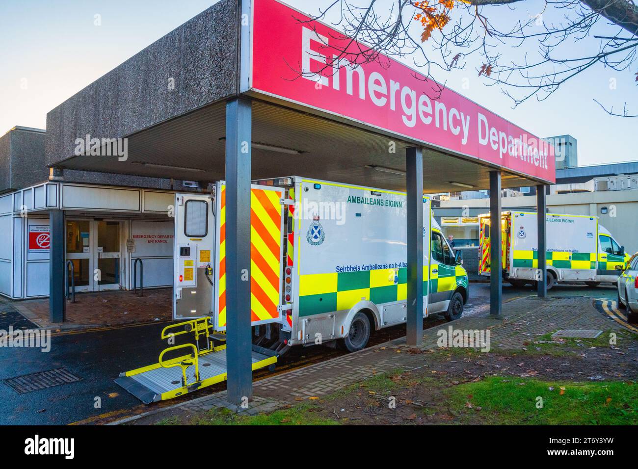 Main entrance to the emergency department with a parked ambulance, NHS Royal Alexandra Hospital, Paisley, Scotland, UK Stock Photo