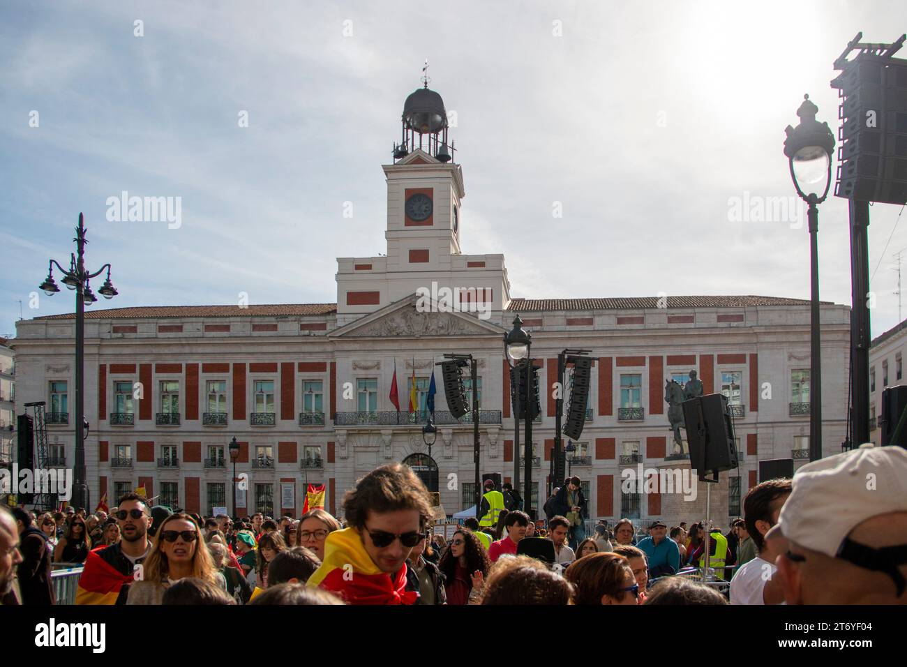 Different images of a demonstration held in Madrid at La Puerta del Sol where different people can be seen walking through the city carrying Spanish f Stock Photo