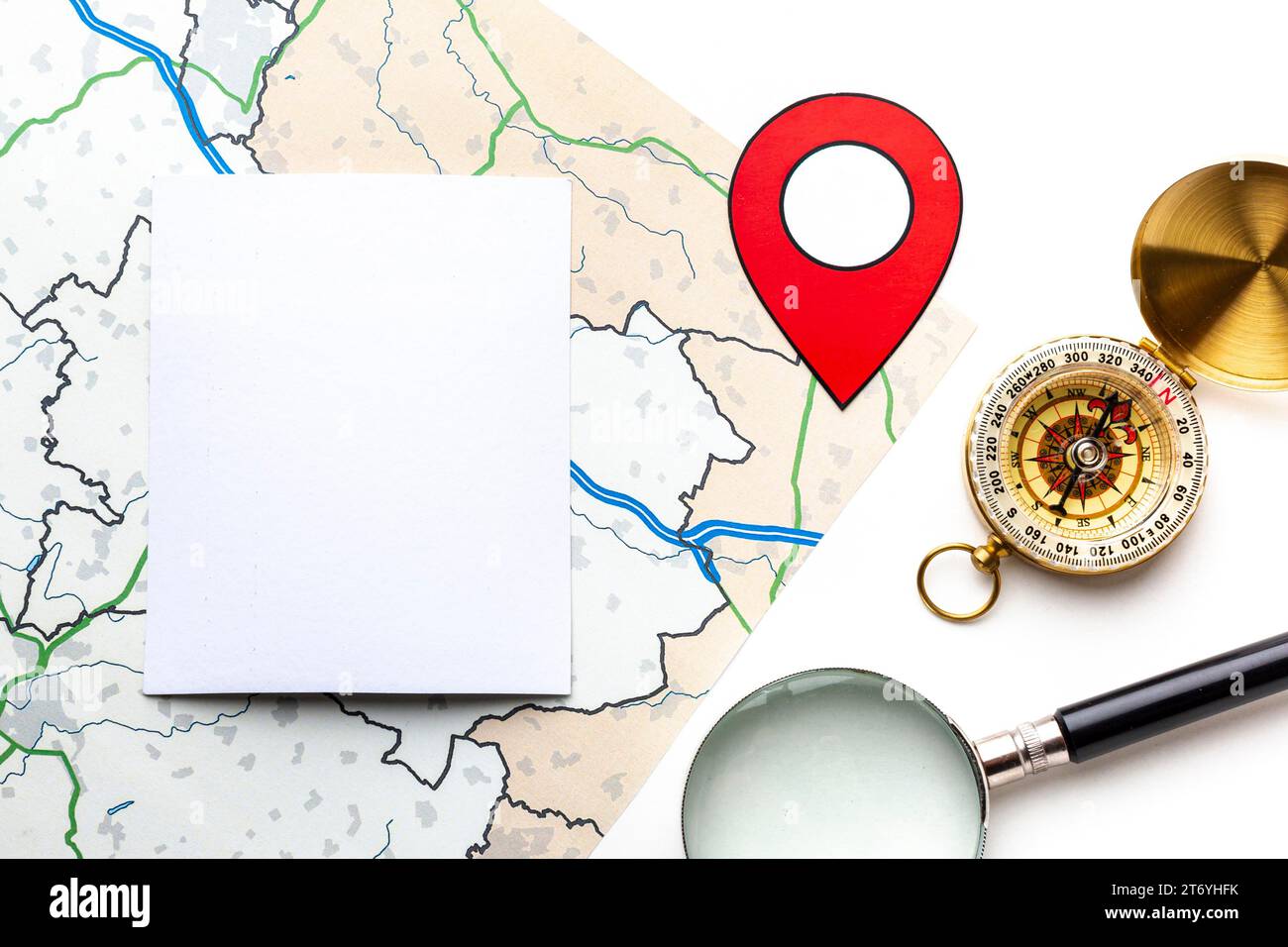 Top view magnifying glass compass Stock Photo
