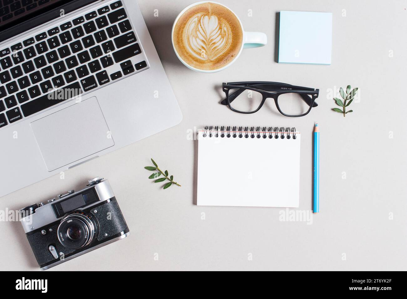 Cup hot coffee cappuccino latte art laptop camera with stationeries ...