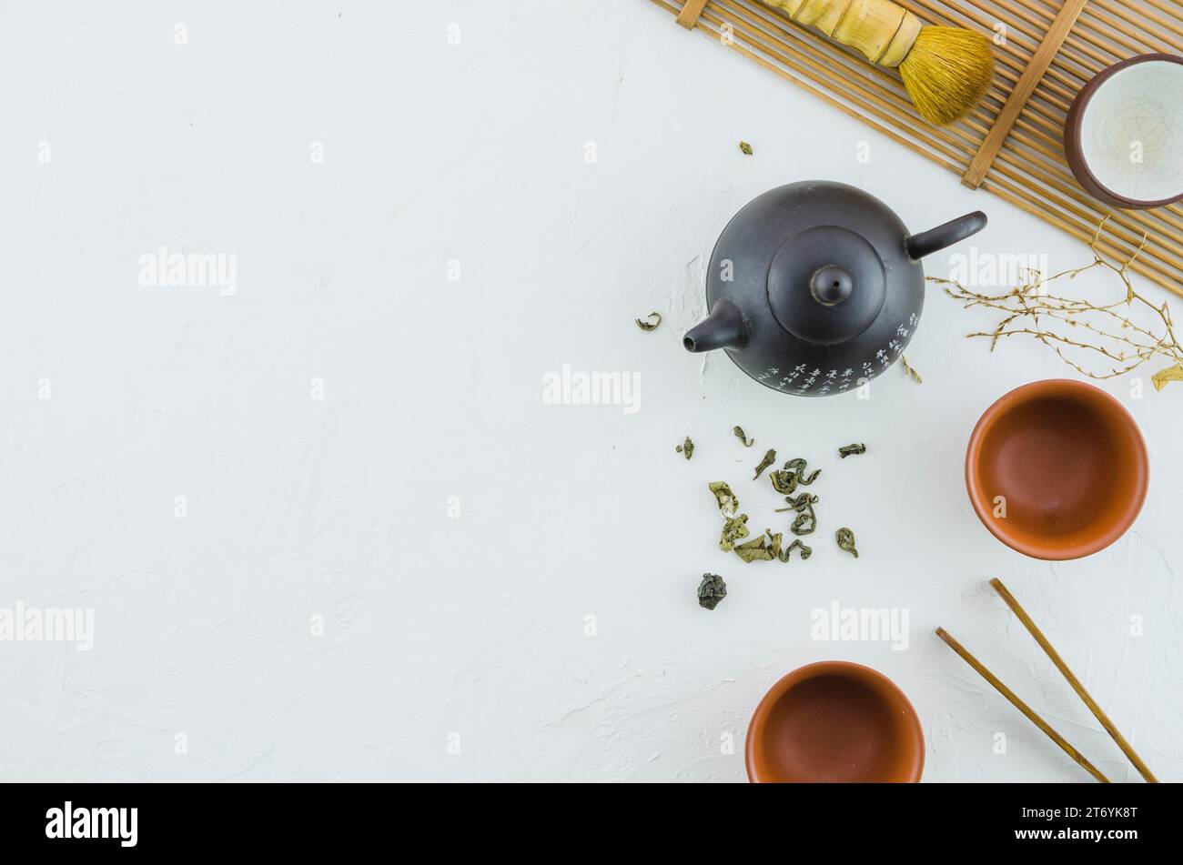 Elevated view japanese herbal tea with tea set white background Stock