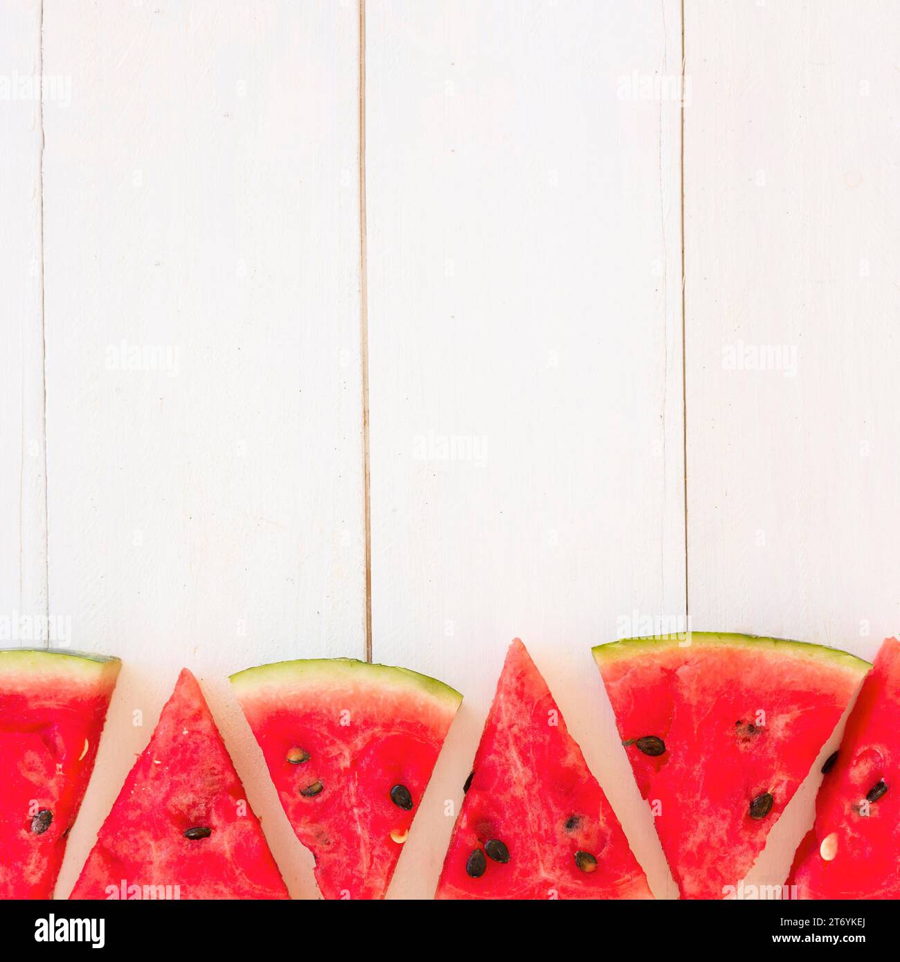 Fresh watermelon slices triangular shape wooden plank Stock Photo - Alamy