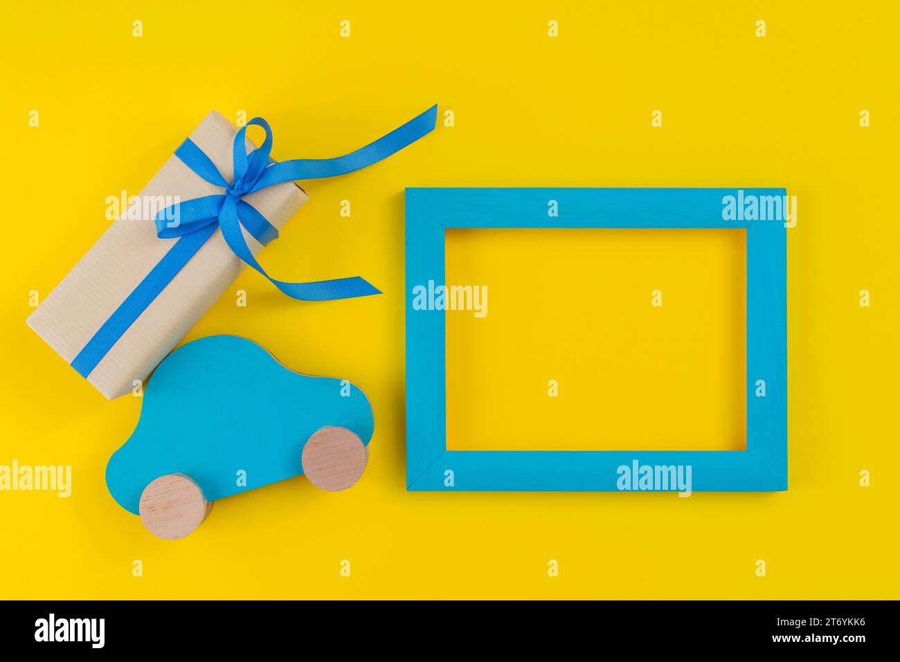Gift box with toy car frame table Stock Photo Alamy