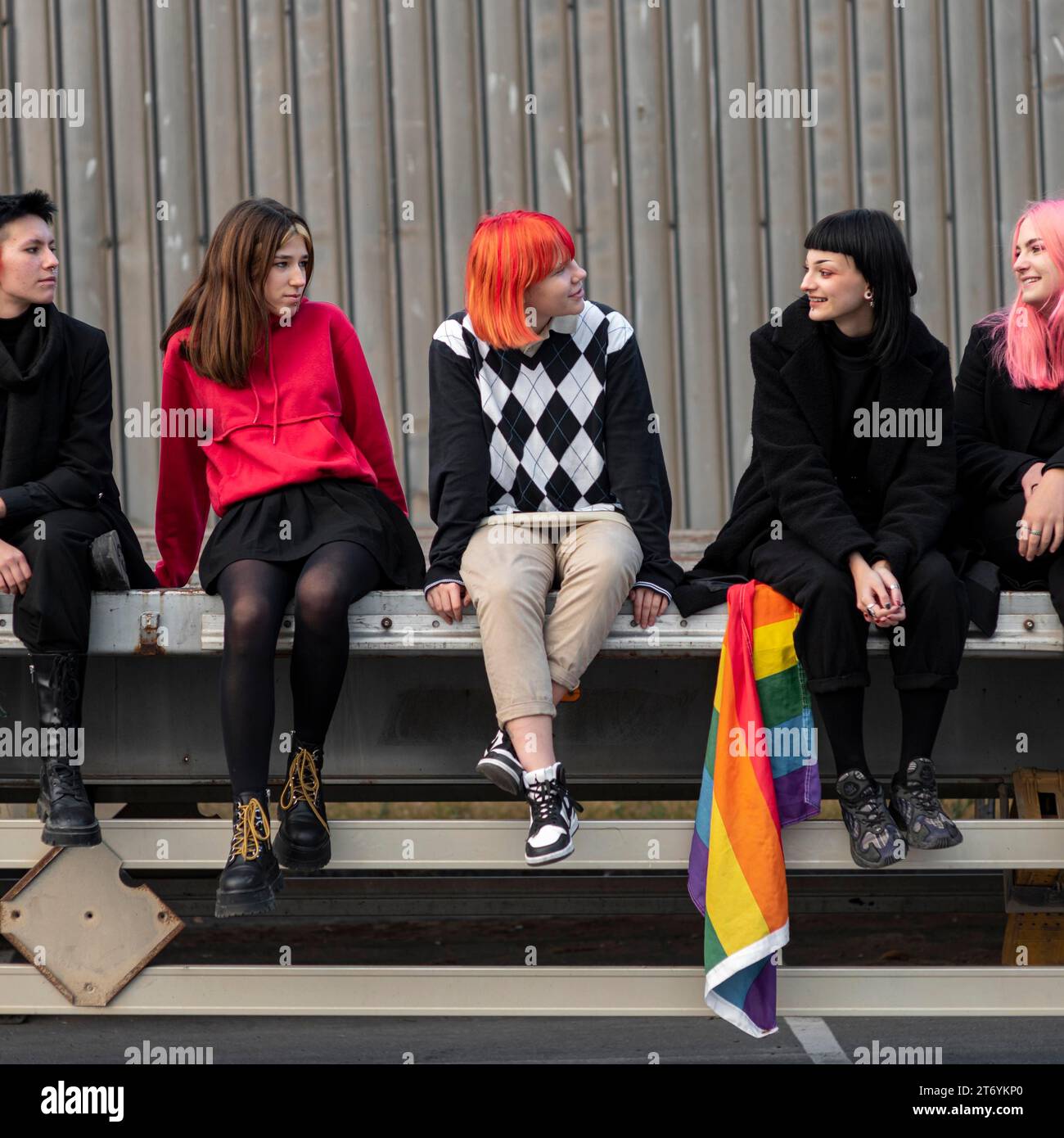 Group non binary friends sitting each other Stock Photo - Alamy