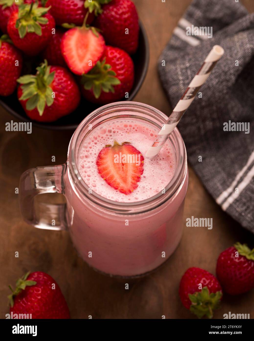 High angle strawberry milkshake with straw Stock Photo