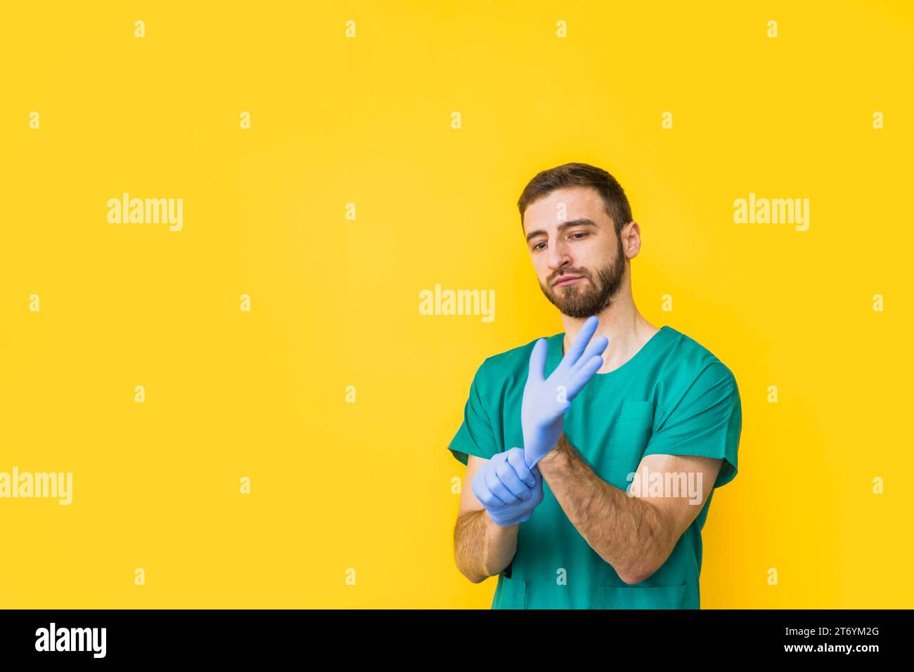 Male doctor putting sterile gloves Stock Photo
