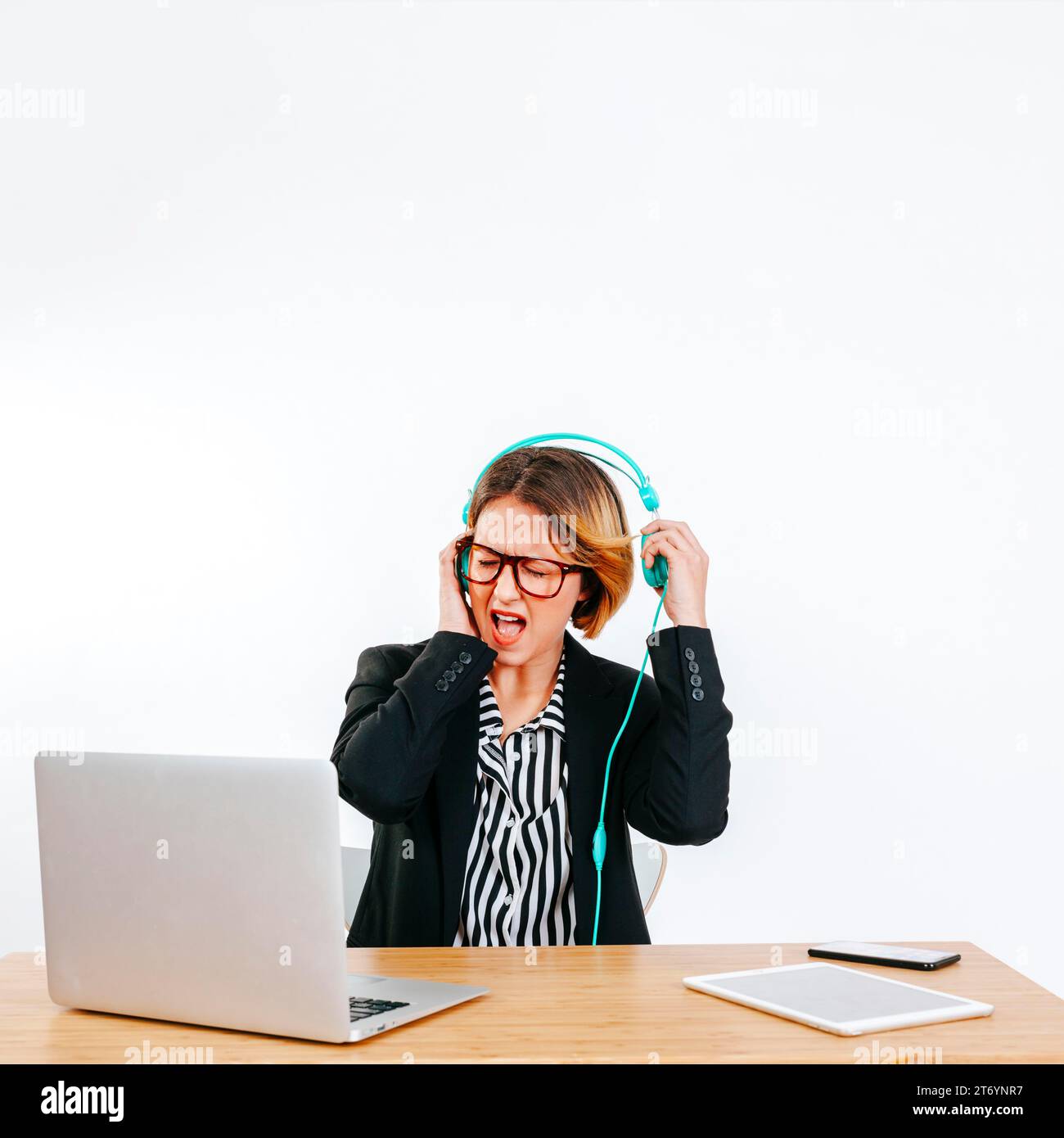 Woman headphones suffering from loudness Stock Photo