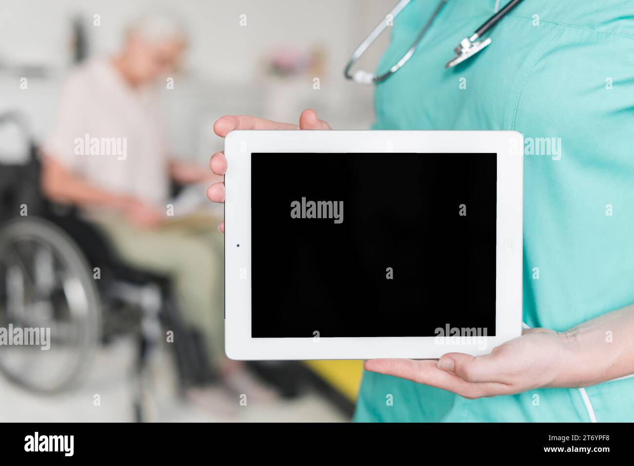 Close up female nurse showing blank screen digital tablet Stock Photo