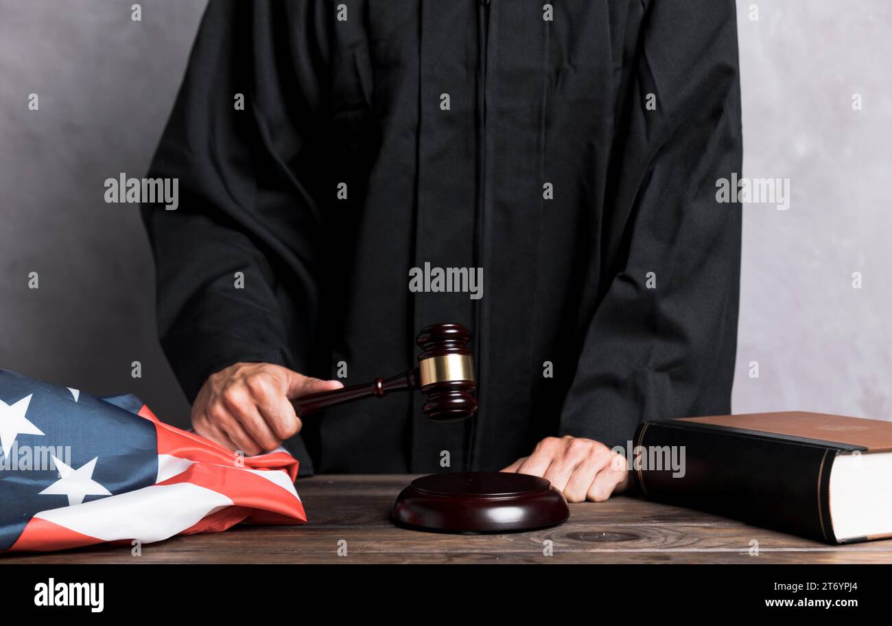 Close up judge striking gavel Stock Photo