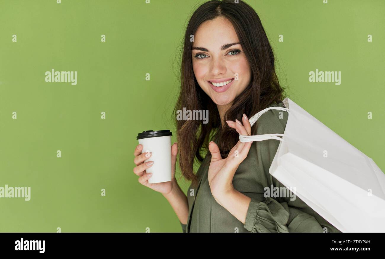 Cute woman green background smiling camera Stock Photo