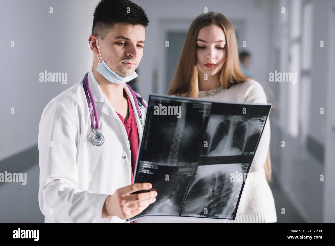 Doctor patient watching x ray Stock Photo