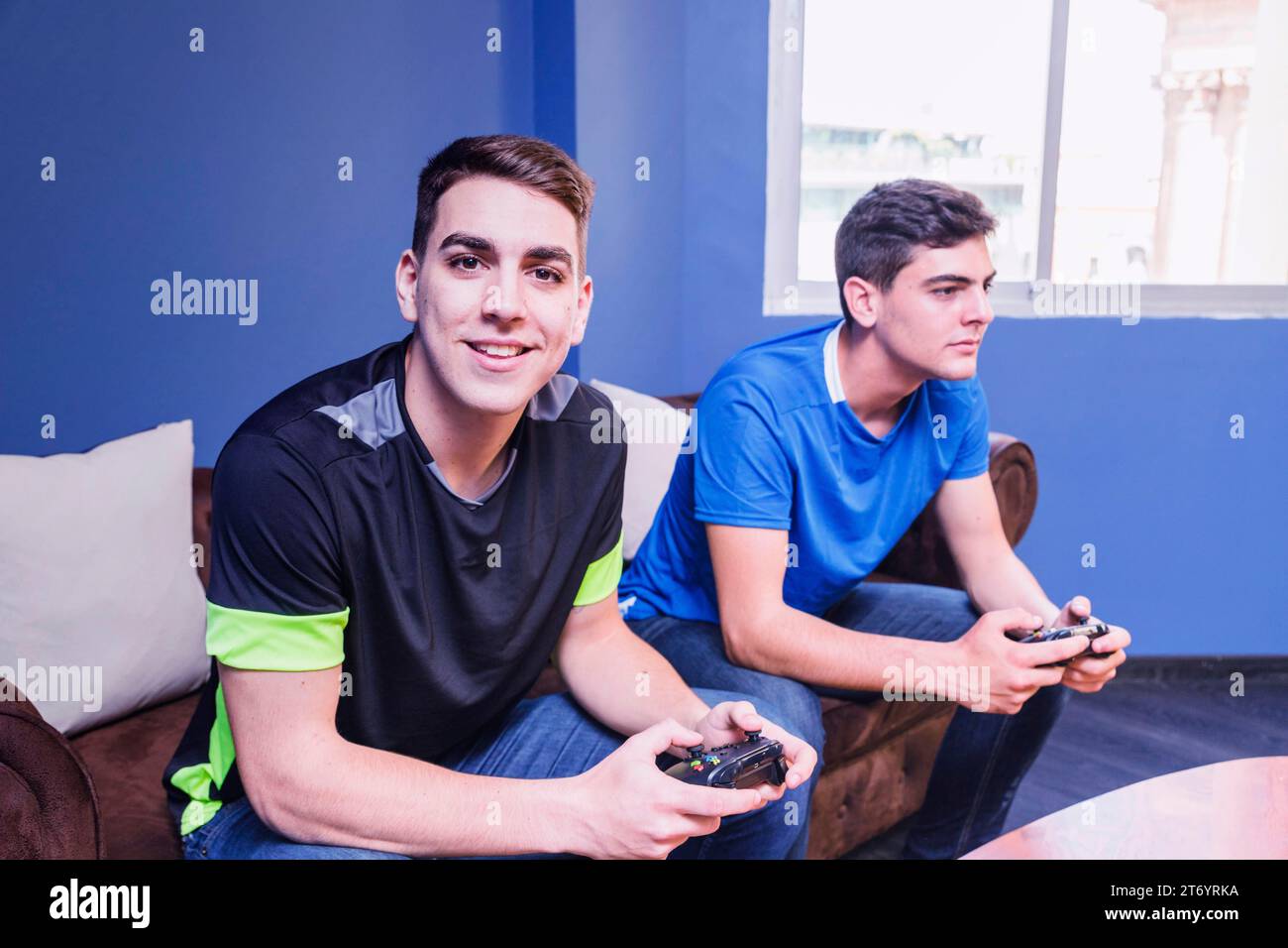Gamers with gamepad couch Stock Photo