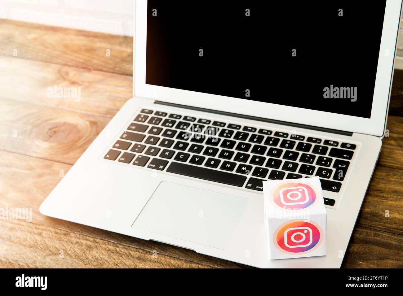 Laptop with instagram icon box office desk Stock Photo