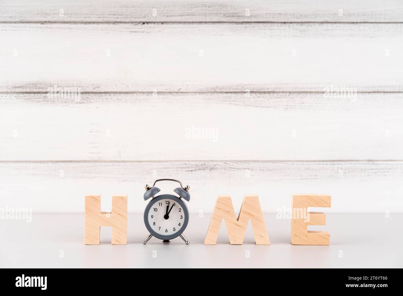 Home lettering with wooden letters clock Stock Photo - Alamy