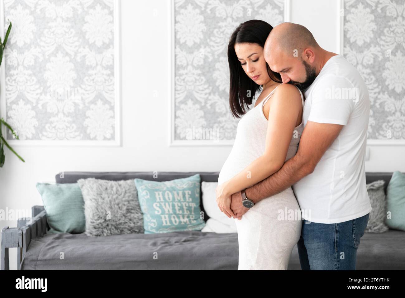 Medium shot pregnant woman spending time with her husband Stock Photo