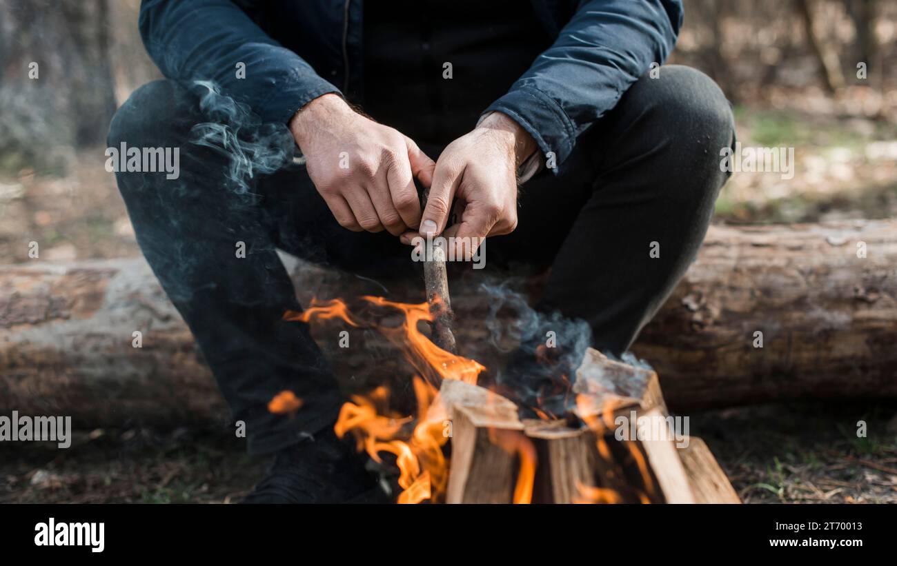 Close up man taking care bonfire Stock Photo