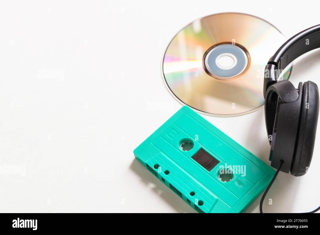 Compact disc turquoise cassette headphone white background Stock Photo