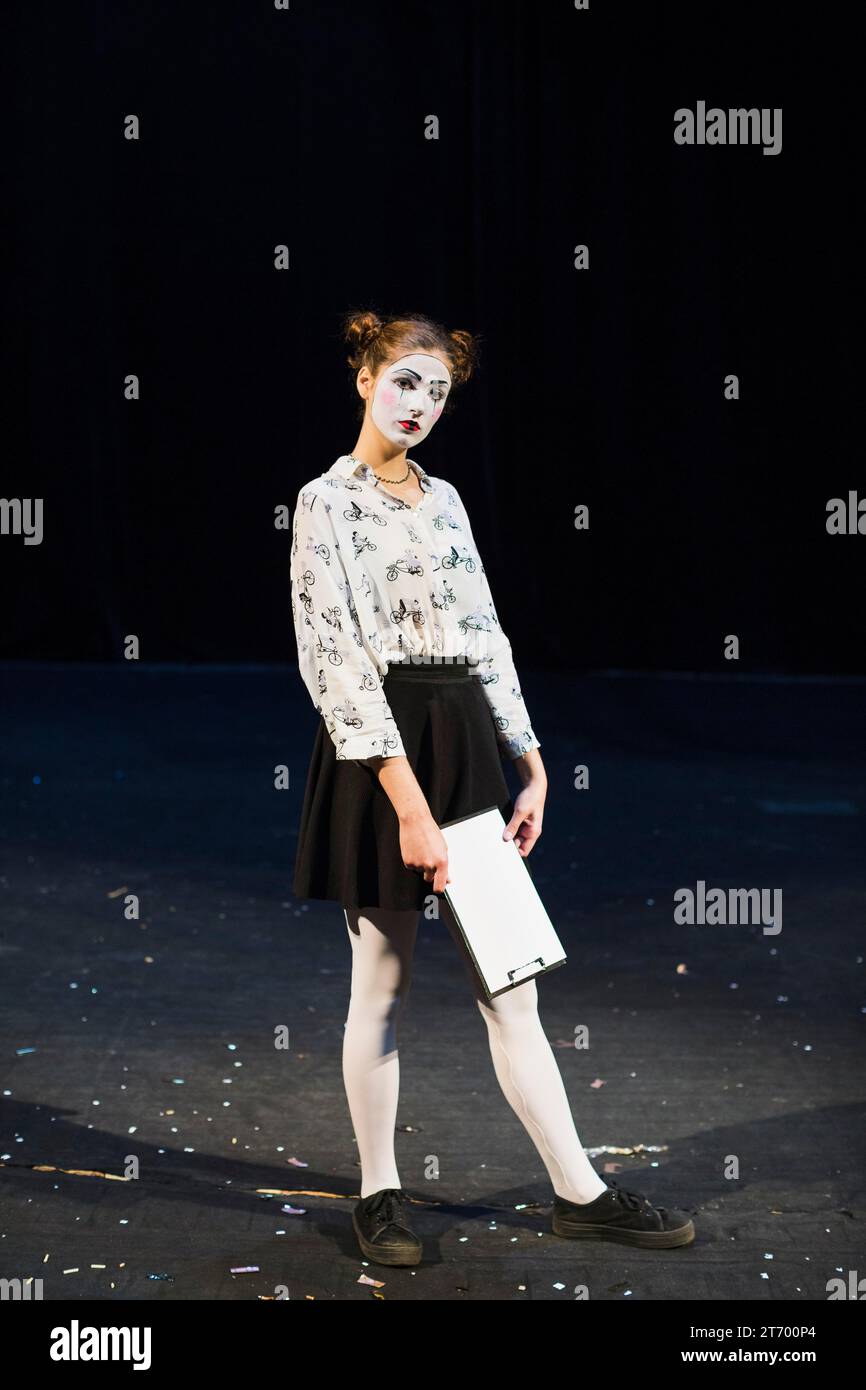 Female mime with manuscript standing stage Stock Photo - Alamy