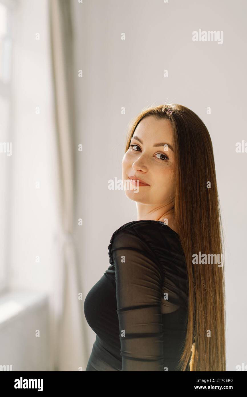 Portrait cute cheerful girl smiling looking at camera over white ...