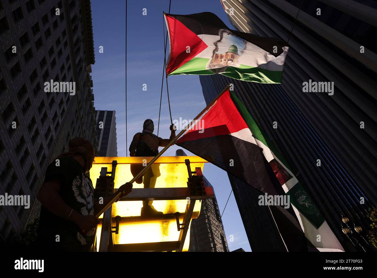 Apec Sf Rally People wave Palestinian flags during the