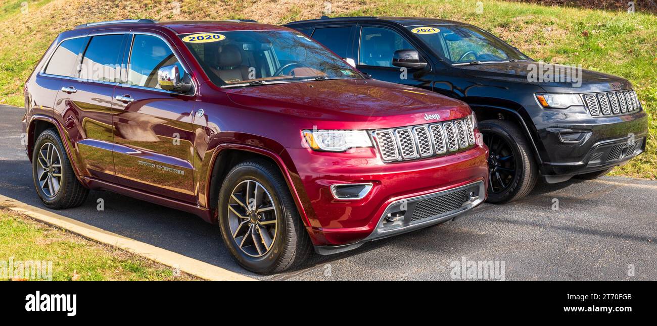 Two different, used Jeep Cherokee SUVs for sale at a dealership in