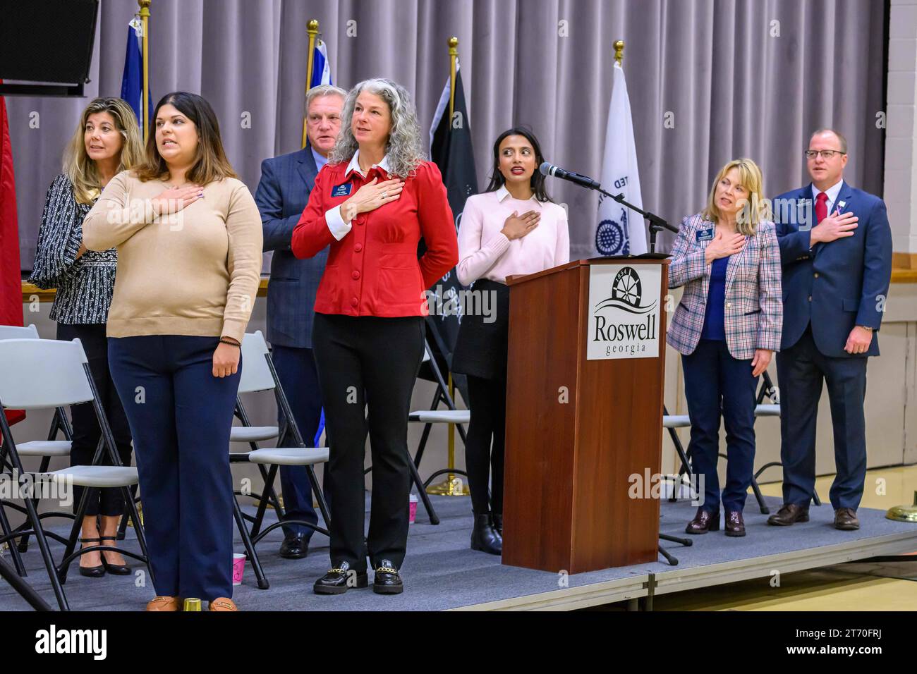 November 11, 2023, Roswell, Georgia, United States: SHIBANI CHAKRABARTY, Outreach Director for Office of Senator John Ossoff, leads the Pledge of Allegiance as residents gather at Roswell Area Park gymnasium to honor U.S. armed forces veterans on Nov. 11, celebrating Veterans Day. The annual event is a heartfelt expression of gratitude to those who have served their country with honor and dedication. Veterans Day, observed as a federal holiday since 1954, was formerly known as Armistice Day, commemorating the end of World War I. Photo by: Stanley Leary/ZUMA Press (Credit Image: © Stanley Leary Stock Photo