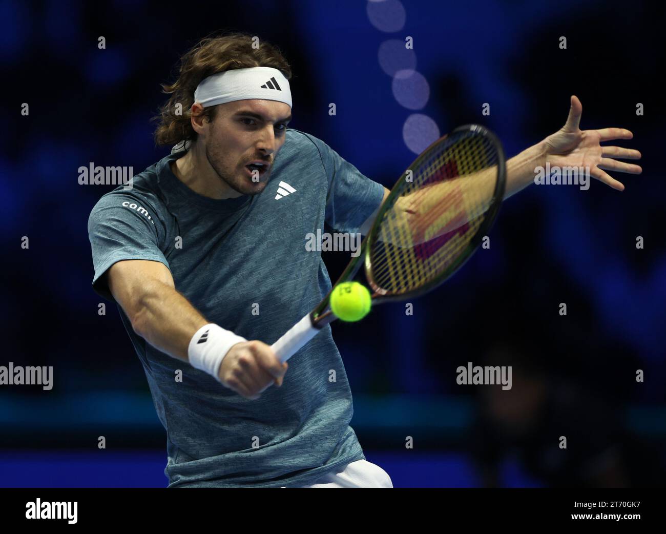 (231113) -- TURIN, Nov. 13, 2023 (Xinhua) -- Stefanos Tsitsipas hits a return during the group stage match between Jannick Sinner of Italy and Stefanos Tsitsipas of Greece at ATP Finals tennis tournament in Turin, Italy, on Nov. 12, 2023. (Photo by Federico Tardito/Xinhua) Stock Photo