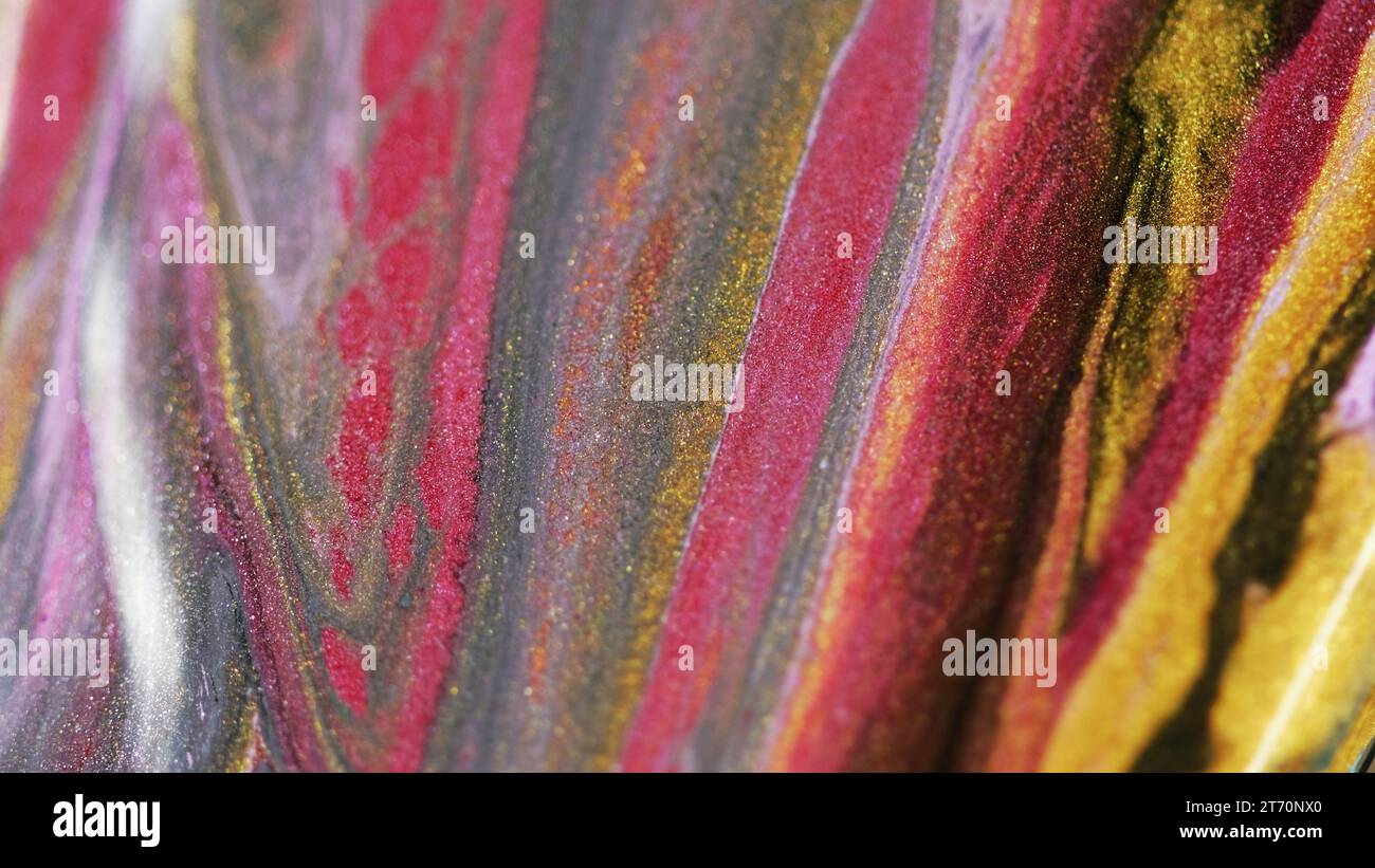 Glitter fluid texture paint flow color ink mix Stock Photo - Alamy