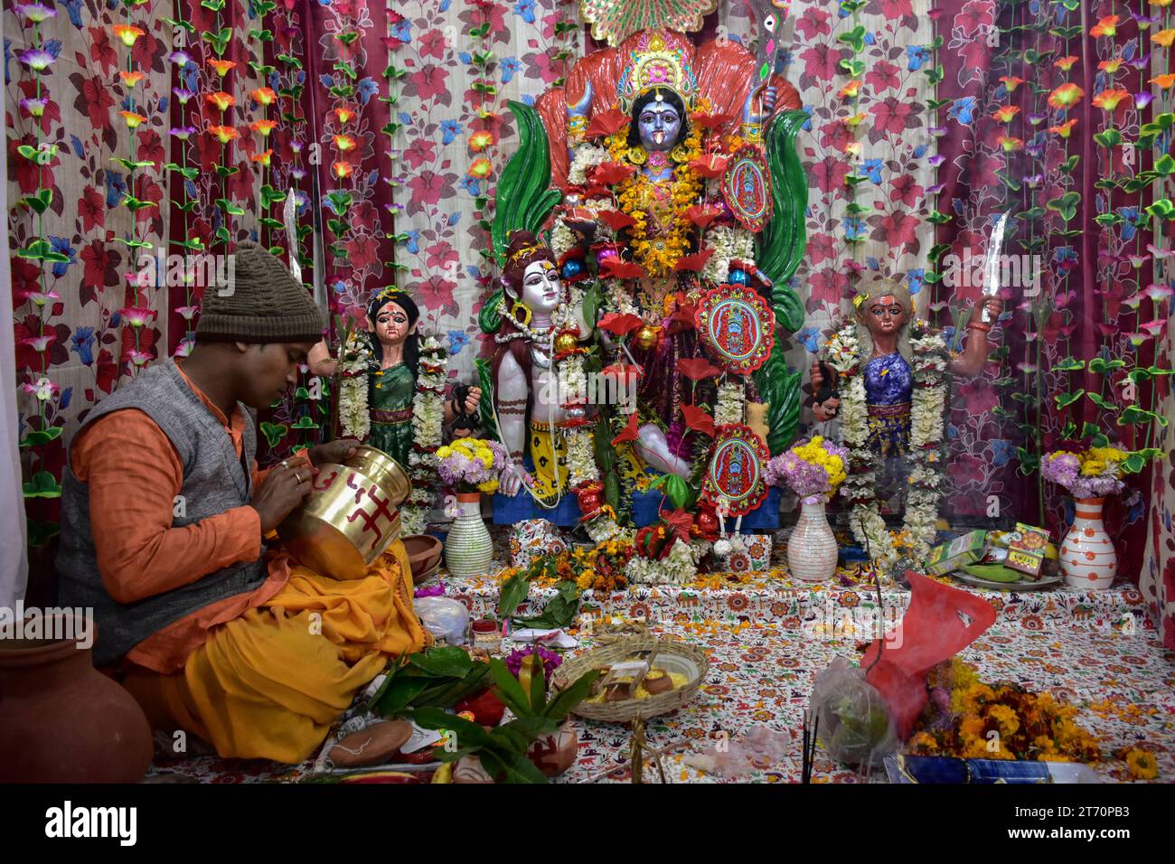 A Hindu priest perform rituals inside the temple on the occasion of ...