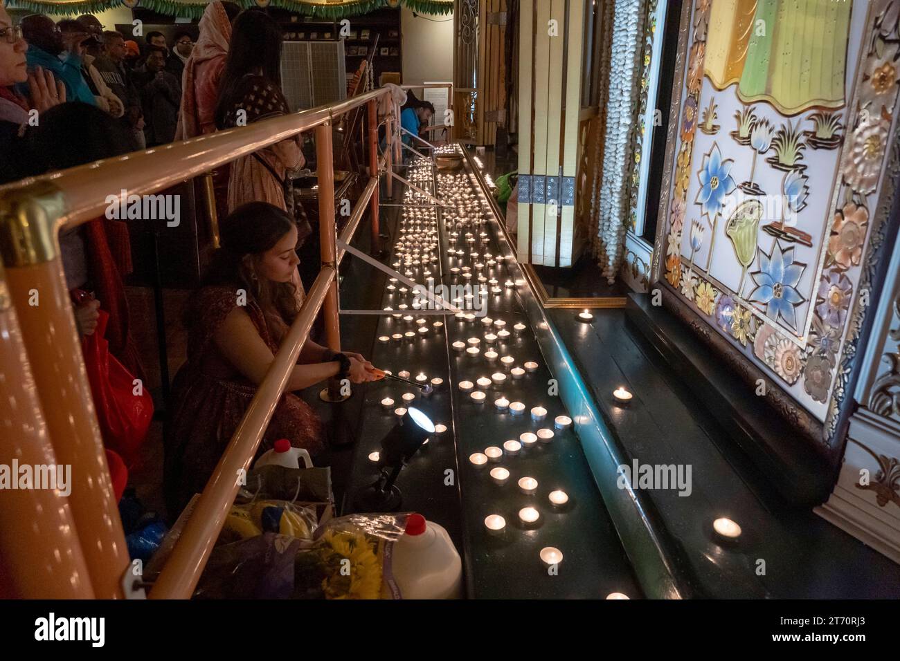 NEW YORK, NEW YORK NOVEMBER 12 Hindu devotees lights candle during a