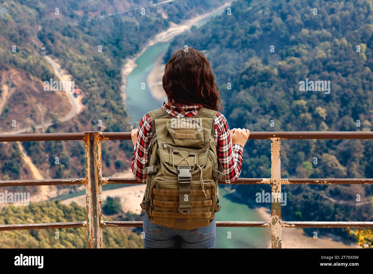 Girl tourist enjoy an aerial view of the Teesta river valley from Lover's point at Darjeeling, India Stock Photo