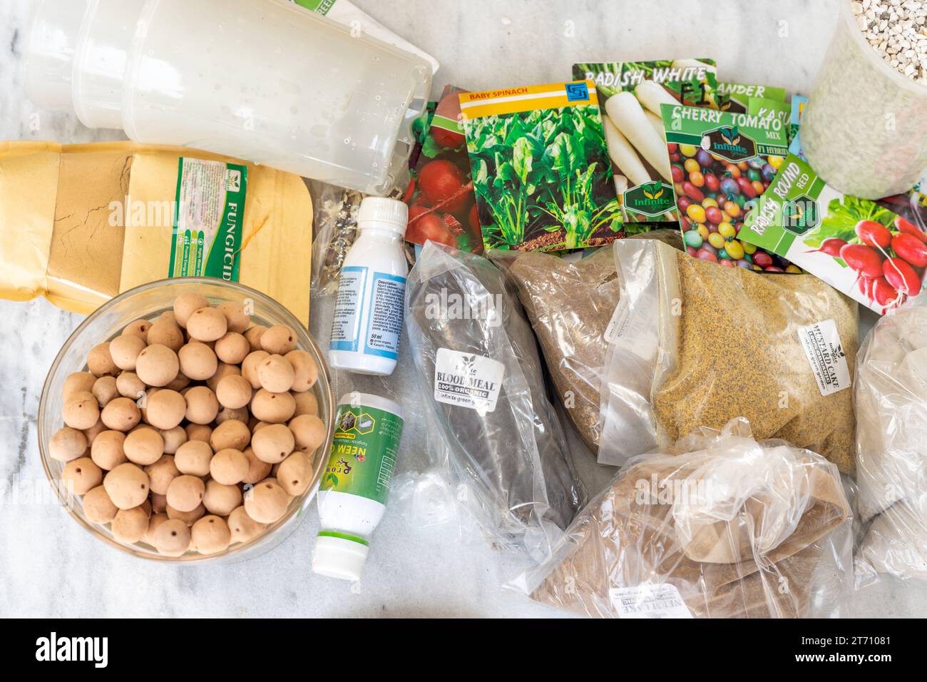 Various packets of vegetable seeds and organic fertilizer plant food