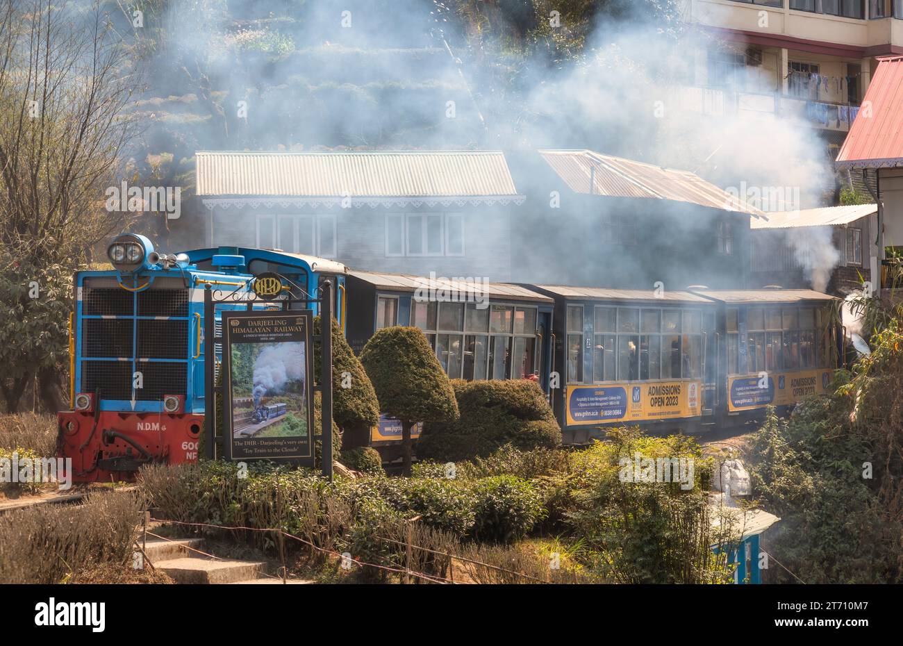 Darjeeling Toy train of the Himalayan railway with view of tourists at
