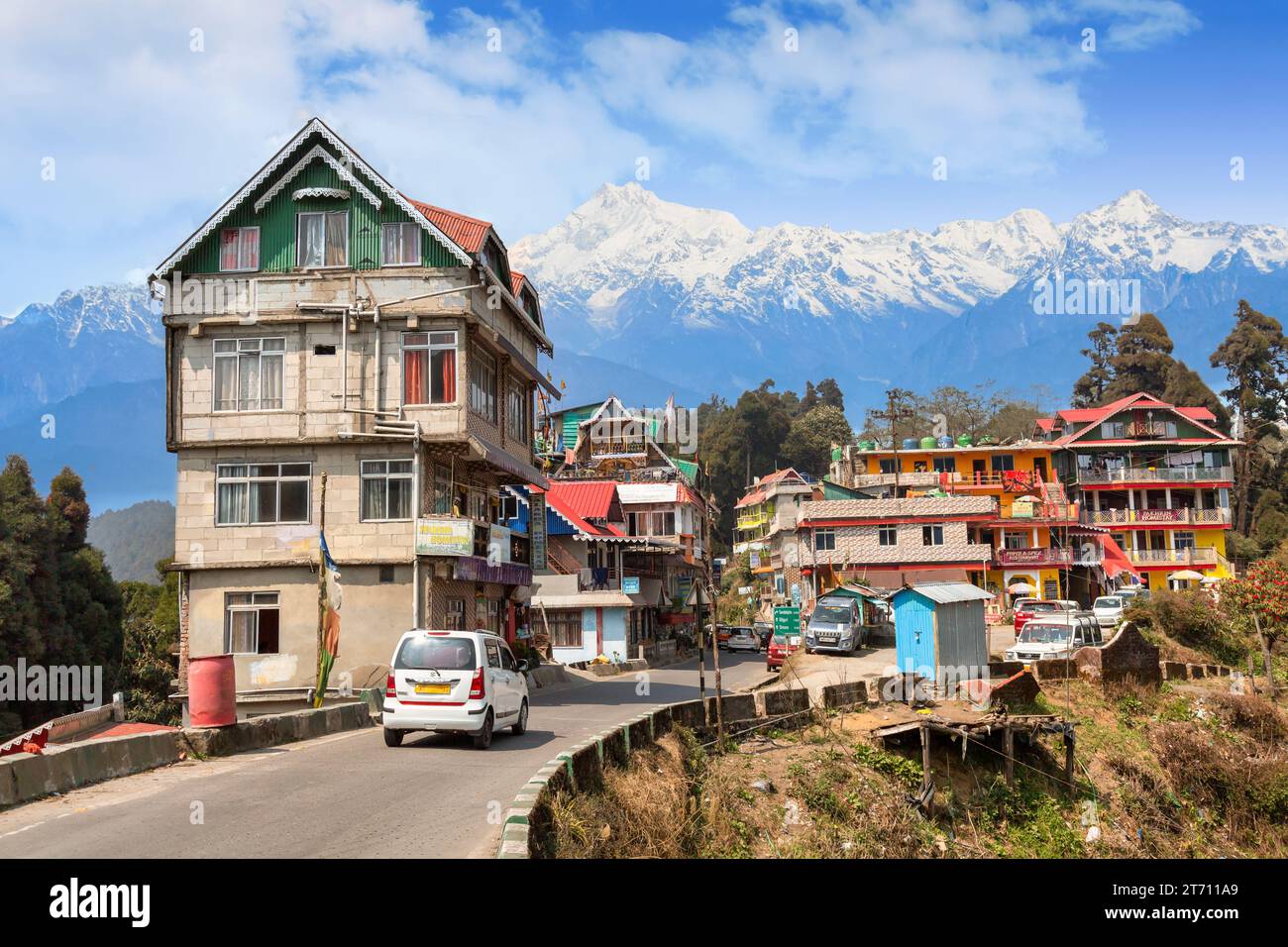 Scenic village town of Tinchuley in the district of Darjeeling, India with view of Kanchenjunga Himalaya mountain range. Stock Photo