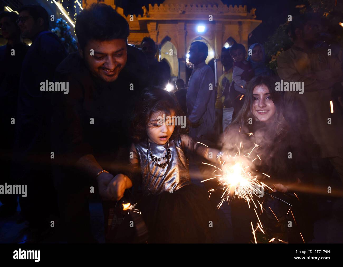 (231113) -- KARACHI, Nov. 13, 2023 (Xinhua) -- People play with firecrackers as they celebrate Diwali, or the Hindu festival of lights, in Karachi, south Pakistan, Nov. 12, 2023. (Str/Xinhua) Stock Photo