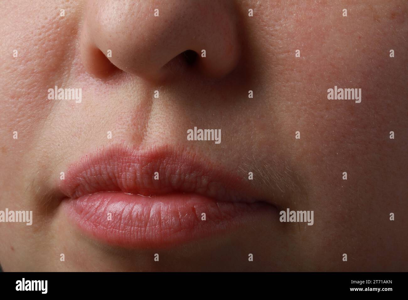 Moisturizing lips beautiful young hi-res stock photography and images ...