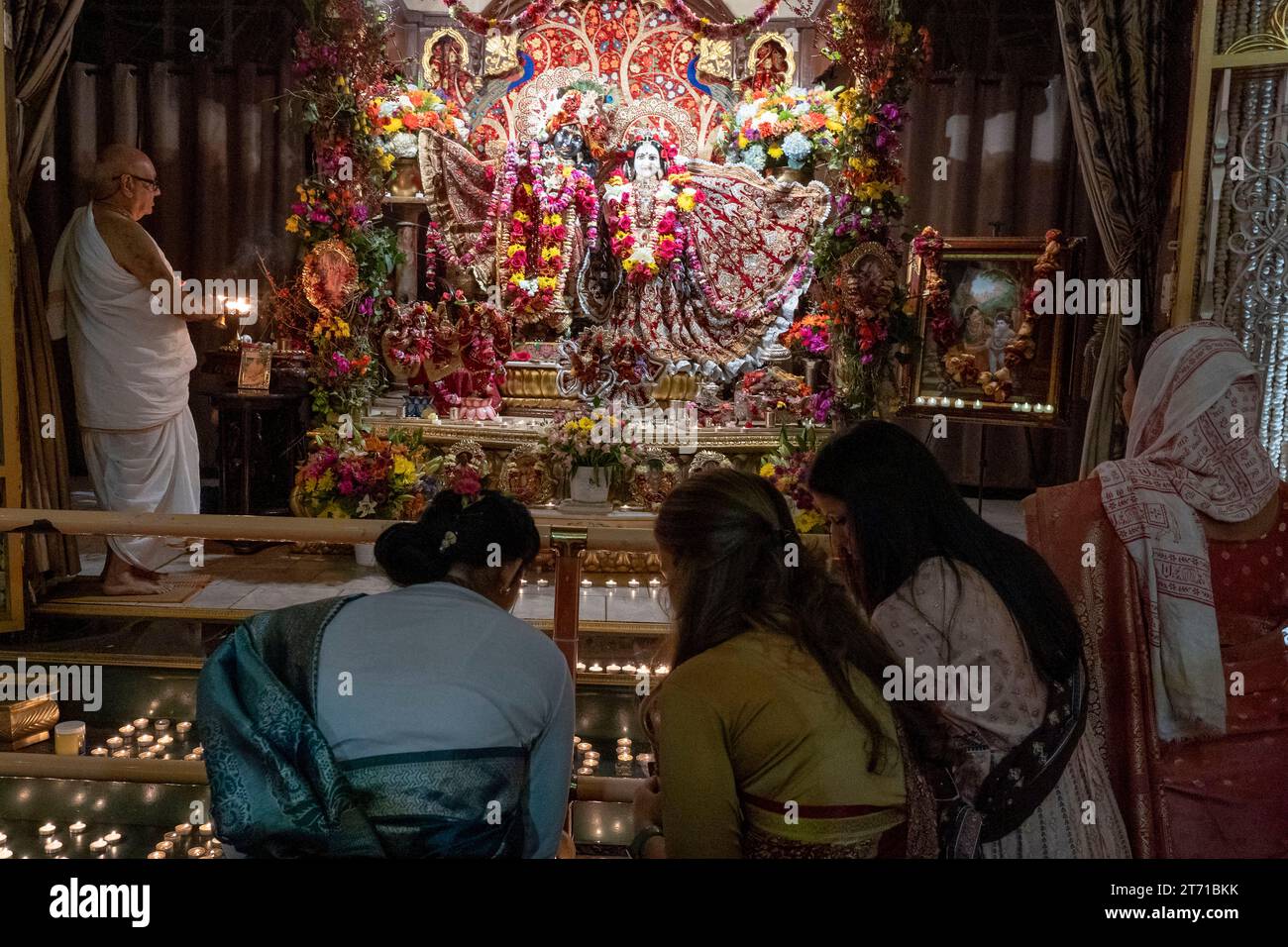 NEW YORK, NEW YORK NOVEMBER 12 Hindu devotees lights candle during a