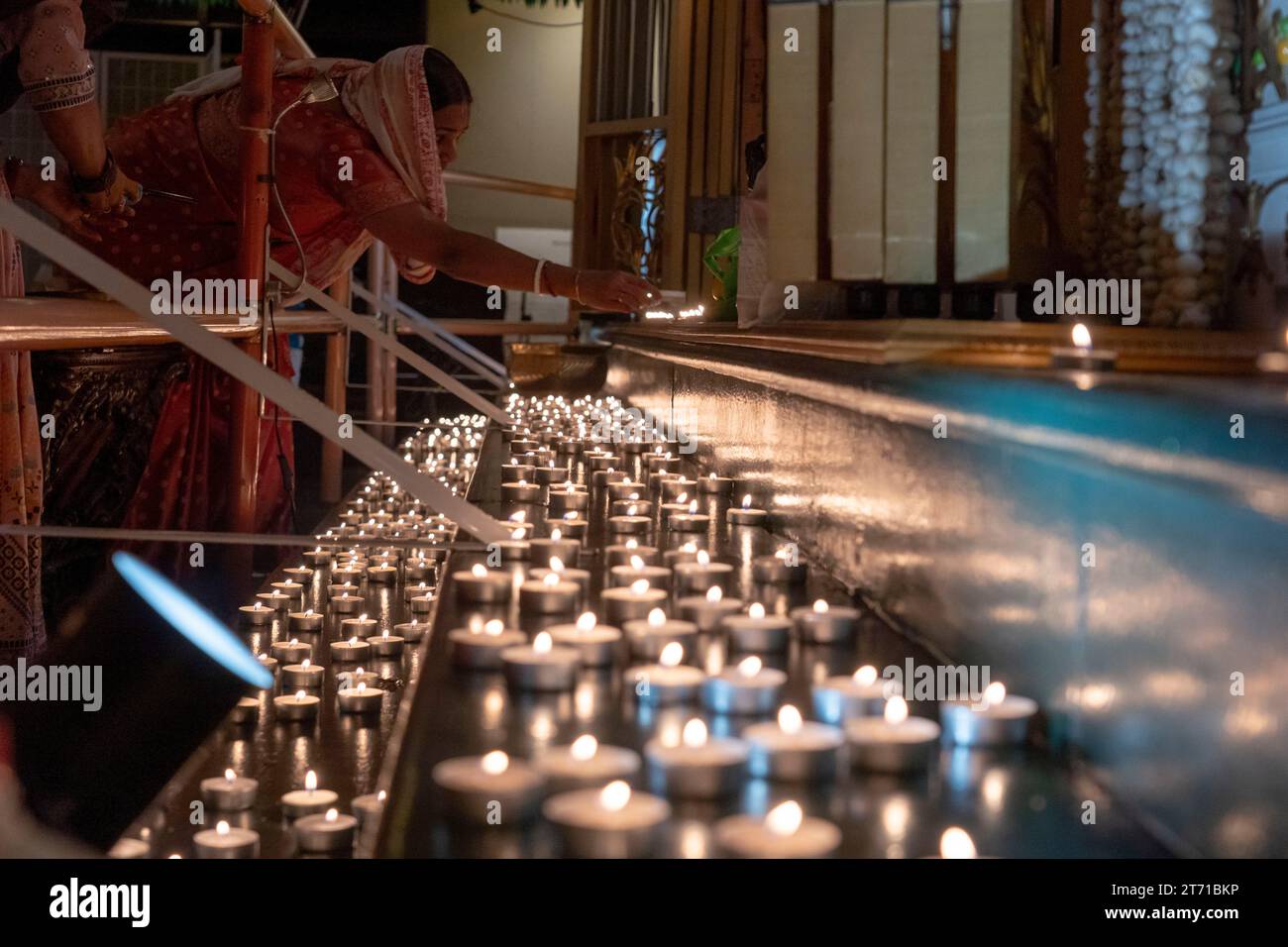 NEW YORK, NEW YORK NOVEMBER 12 Hindu devotees lights candle during a