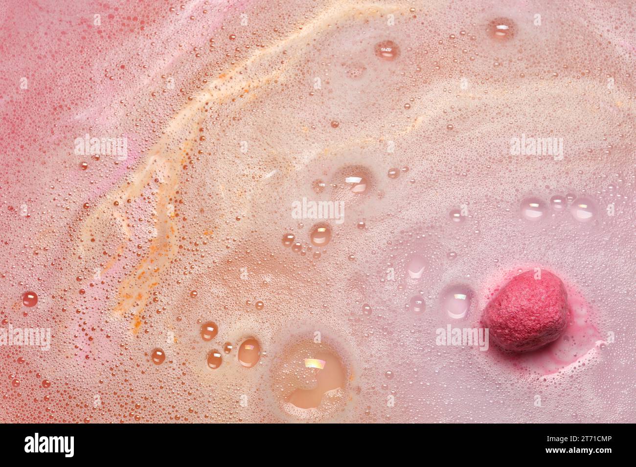 Beautiful pink bath bomb dissolving in water Stock Photo Alamy
