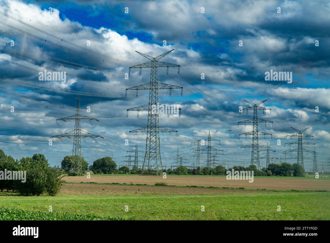 Electric Power Transmission Towers on a cloudy day Stock Photo - Alamy